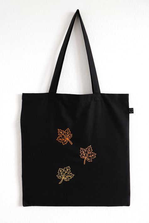 Black tote bag made from high quality organic cotton with hand-embroidered maple leaves Black Tote Bag Embroidery, Toat Bag, Knots Embroidery, Tote Bag Embroidery, Frog Bag, Tot Bag, Bag Embroidery, Unique Tote Bag, Embroidered Tote Bag