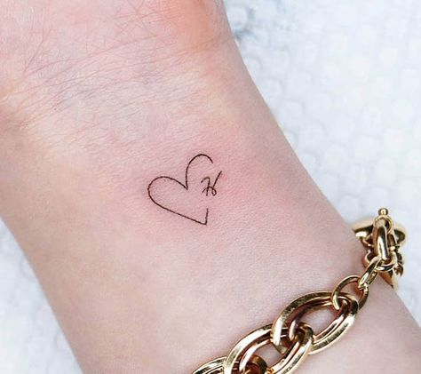 Small heart-shape H tattoo by @tattoo.choi Small Husband Tattoo, T Heart Tattoo, Partners Initials Tattoo, Cute Boyfriend Tattoo Ideas, Heart M Tattoo, Partner Initial Tattoo, Ellie Name Tattoo, Tony Heart Tattoo, Small Heart Tattoo With Initials