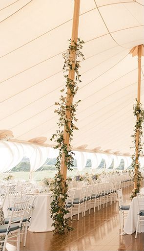 Tent Poles w/ Ivy and floral Marquee Poles Foliage, Decorating Poles For Wedding, Greenery On Tent Poles, Flower Poles Wedding, Pole Decorations Ideas Wedding, Wedding Pole Decorations, Tent Flower Decorations, Tent Pole Greenery, Wedding Tent Flowers