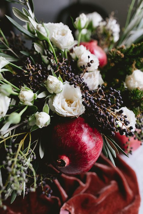 Luxe Holiday Centerpiece with Pomegranates | DIY | Jojotastic Christmas Table Floral Centerpiece, Modern Holiday Floral Arrangements, Pomegranate Flower Arrangement, Pomegranate Floral Arrangement, Holiday Floral Centerpieces, Pomegranate Christmas Decor, Christmas Greenery Centerpiece, Christmas Flowers Arrangements, Pomegranate Centerpiece