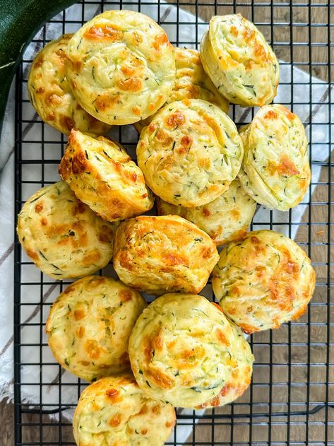 a top down image of a wire baking rack full of freshly baked zucchini puffs Buttermilk Quick Bread, Puffs Recipes, Homemade Biscuit Mix, Zucchini Puffs, Veggie Casserole Recipes, Zucchini Bake, Baking Rack, Fresh Zucchini, Baked Zucchini