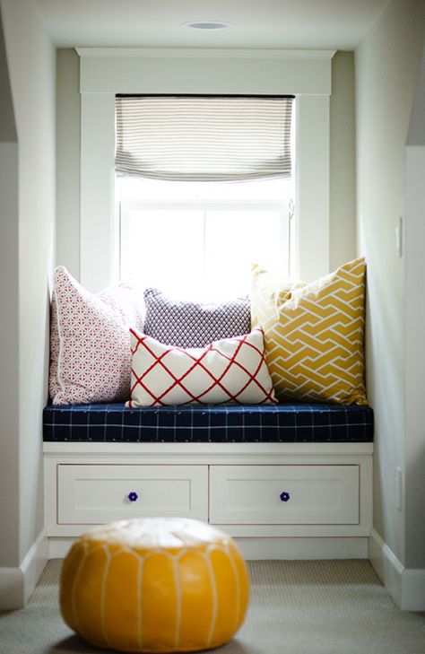 By squeezing a bench into an unused dormer you get bonus seating without taking up precious space. Here, a navy cushion and patterned pillows makes this space cozy — and stocky drawers help you stay organized. See more at Design Sponge »   - HouseBeautiful.com Dormer Window Ideas, Dormer Ideas, Window Seat Nook, Space Window, Cozy Window, Dormer Window, Cozy Window Seat, Window Nook, Country Chic Cottage