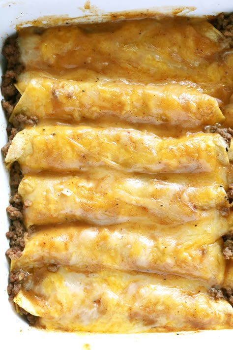 A close up shot of Tex Mex Beef Enchiladas in a rectangle white baking dish. Mexican Brown Gravy Enchilada Sauce, Restaurant Enchiladas, Enchiladas Dinner, Homemade Beef Gravy, Chili Gravy, Enchiladas Beef, Beef Enchilada Recipe, Dinner Beef, Ground Beef Enchiladas