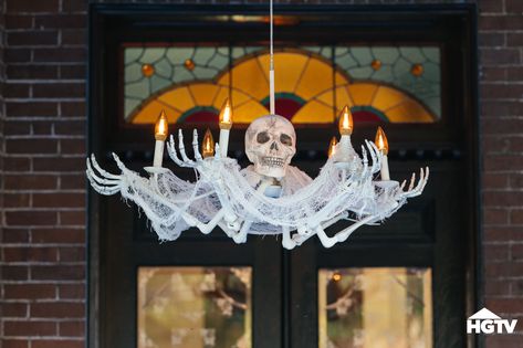 Learn how to turn a thrifted light fixture into stylish and spooky lighting decor for Halloween. Skeleton Chandelier, Spooky Lighting, Halloween Chandelier, Halloween Decorating Ideas, Halloween Diy Outdoor, Doorway Decor, Easy Diy Halloween Decorations, Halloween Decorations Diy Outdoor, Easy Halloween Decorations