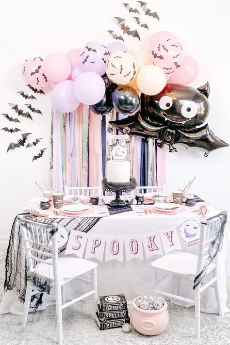 Don't miss this fun spooky Halloween party! The cake is so magical! See more party ideas and share yours at CatchMyParty.com Two Spooky Birthday Decor, Pink Halloween 1st Birthday Party, Spooky Babe Birthday, Girly Spooky Birthday, Pink Halloween Decor Birthday, Lil Spooky, Halloween Balloon Garland, Bat Party, Halloween Brunch