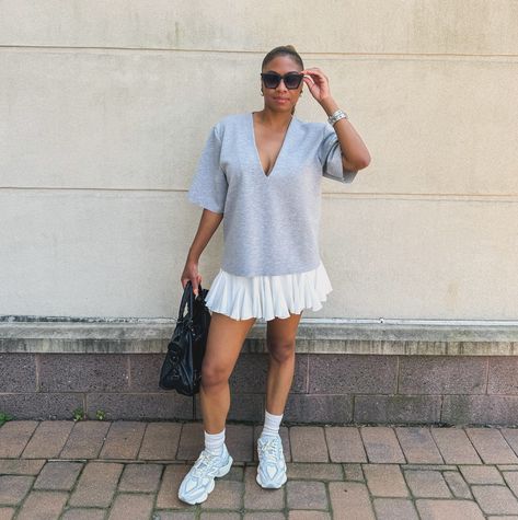 The choice is yours… Do we like rocking our tennis skirts with chunky sneakers, like New Balances or do we prefer a low top sneaker like the adidas sambas? If you want the link for the skirt. Comment skirt and I will send you the link. Outfit Deets: Top: @asos Skirt: @amazon Sunnies: @topfoxx Bag: @balenciaga Happy Monday Luvs! Chunky Sneakers Skirt Outfit, Tennis Skirt And New Balance Outfit, Mini Skirt New Balance, Tennis Athleisure Pleated Skirt, Adidas Chunky Sneakers, Outfits With Tennis Shoes, Tennis Skirt Graphic Tee, Chunky Sneakers Outfit, Balenciaga Outfit