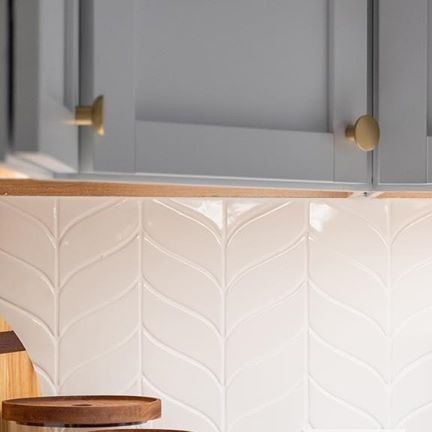 Tile Wholesalers of Rochester on Instagram: "6th Ave in Curved Chevron by @walkerzanger is a delightful change from subway tile, but still keeps the kitchen feeling clean and simple. . . . #tilewholesalers #rochester #luxury #tiles #inspo #interiordesign #bathroom #kitchen #livingroom #shower #home #design #style #inspiration #marble #mosaic #glass #porcelain #ceramic #custom #beautiful #vintage #handmade #flooring #architecture #remodel #decor #backsplash #renovation #tile" Chevron Fireplace, Chevron Backsplash, Luxury Tiles, Fireplace Tile, Marble Mosaic, Subway Tile, Kitchen Backsplash, Design Style, Mosaic Glass