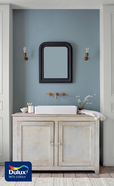 Turn your bathroom into a soothing sanctuary with this grey blue shade Denim Drift. It works perfectly with distressed furniture and brass fixtures.   #bathroom #bathroomdecor #greyblue Brass Fixtures Bathroom, Denim Drift, Small Bathroom Colors, Refinish Bathtub, Small Bathtub, Bathroom Remodel Cost, Bathroom Decor Colors, Fixtures Bathroom, Downstairs Toilet