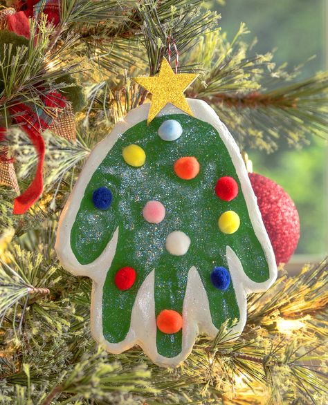 Learn the easiest way to make a handprint ornament! No dough mixing. These Christmas handprints are so fun for kids, and great memories!