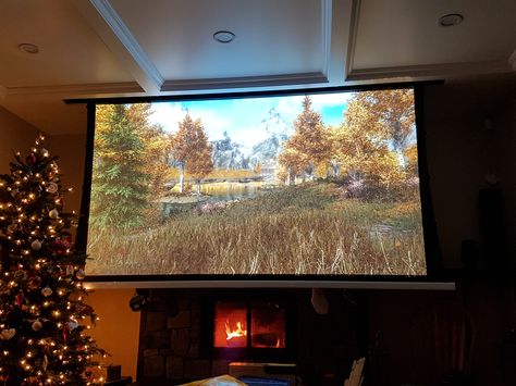 Projector Screen Living Room, Projector Ideas, Tv Above Fireplace, Diy Projector, Ceiling Projector, Projector Tv, Build House, Elder Scrolls V Skyrim, Projection Screen