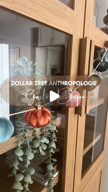 DIY + Home Renovation | Kate Banks on Instagram: "Anthropologie fall decor pumpkin garland at Dollar Tree? Yes please!! I love a good Anthro look for less!! 

These velvet pumpkin clips are fully stocked in so many Anthro-vibe colors at my Dollar Tree right now. Pop over to yours before all the good fall decor gets swooped. 

Here’s what I did to get this look for less: 

✨ Grab 5 packs of 3 velvet pumpkin clips in whatever colors you’re feeling. I felt like the pink and blue mixed into the fall colors really sold it as an Anthro piece 
✨ gently pull the clips out of the bottom of the pumpkin and peel off any hot glue left behind
✨ Cut your twine much longer than you actually want it (you’ll need extra for all the times you loop it around the pumpkin and for hanging)
✨gently lift the stem Dollar Store Fall Decor, Dollar Tree Fall Decor Diy, Anthropologie Fall, Fall Decor Dollar Tree, Dollar Tree Fall, Pumpkin Garland, Tie A Knot, Decor Ideas For Living Room, Pumpkin Fall Decor