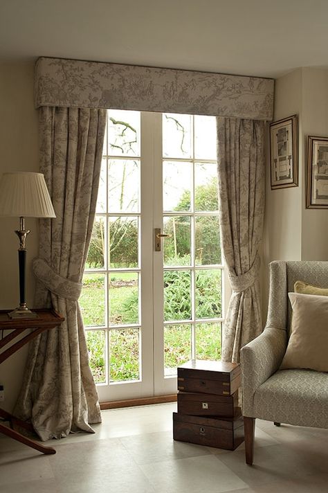 These curtains have a tape heading that is popular as it offers a neat finish without being too formal. It suits all fabric types and can go on a pole or track, with or without a pelmet. Our photo features a matching pelmet and set of tie-backs with contrast piping. Get yours https://www.fabricsandpapers.com/made-to-measure-curtains #MadeToMeasure #Bespoke #Custom #WindowTreatments #Drapes Curtains With Pelmet, Pelmet Ideas, Pelmet Designs, Curtain Pelmet, Curtains And Pelmets, Pencil Pleat Curtains, Window Curtains Living Room, Pleat Curtains, Curtain Styles