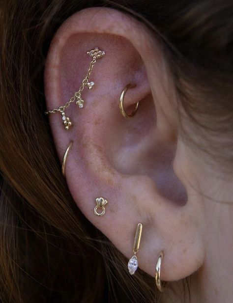 Earring Stacks Both Ears, Dainty Ear Styling, Dainty Gold Piercings, Earring Curation Gold, Gold Earring Curation, Interesting Ear Piercings, Mixed Metal Ear Piercings, Ear Piercing Stacking Ideas, Minimalistic Ear Piercings