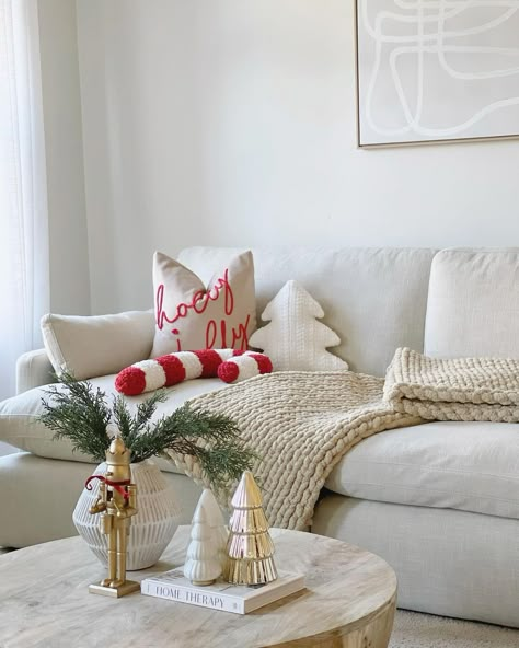 New Year Living Room Decor, White Couch Christmas Decor, Studio Apartment Christmas Decor Ideas, Christmas Decor In Living Room, Cream And Red Christmas Decor, Pops Of Red Christmas Decor, Beige And Red Christmas Tree, Red And Beige Christmas Decor, Red And Cream Christmas Decor