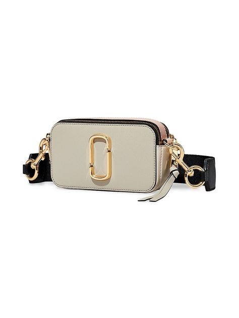 "Find MARC JACOBS The Snapshot on Editorialist. Marc Jacobs' signature camera bag silhouette featuring a striped webbing strap and colorblock leather construction. Adjustable removable crossbody strap Dual top zip Goldtone hardware 2 interior compartments Interior slip pocket Leather Imported SIZE 7.5\"W x 4.5\"H x 2.5\"D. Marc Jacobs. Color: Coconut." Snapshot Marc Jacobs, Marc Jacobs Handbag, Purse Ideas, Leather Camera Bag, Dream Bags, Bold Logo, Webbing Strap, Designer Crossbody, Secret Service