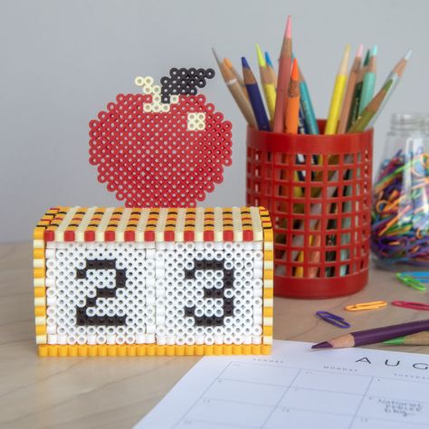 It’s almost back-to-school time! This perpetual calendar made from Perler fuse beads is perfect for gifting to a special teacher. 3d Perler Bead, Bee Wall, Retro Bracelet, Melting Beads, Iron Beads, Bead Ideas, Egg Designs, Fun Crochet Projects, Perpetual Calendar