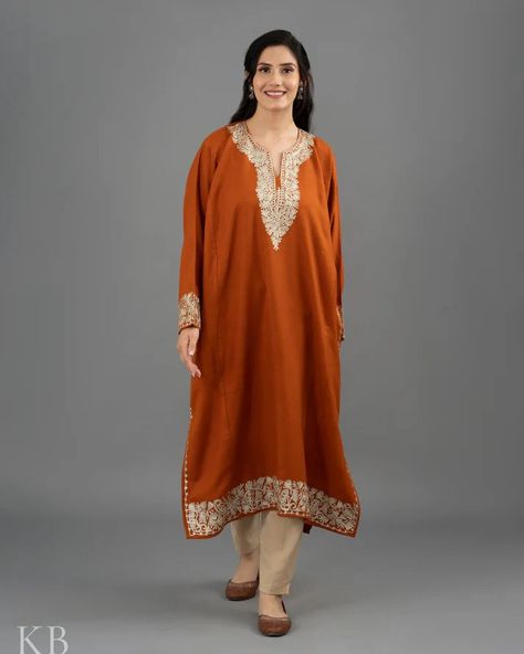 https://tinyurl.com/bdcwcme4 Zari Embroidered Orange Cashmilon Phiran Product Details Fabric - Fine Cashmilon Color - Rust Orange Care - Dry Clean Wash Embroidery - Kashmiri Zari Embroidery Type - 2 Side Pockets Time To Make - 10-15 Days COD - Available The bright and vivid silver zari embroidery adorns on a wonderful rust orange coloured fine cashmilon base. You can pair it with jeans or palazzos and turn heads wherever you go! #amritsarbridal #punjabibridaljewellery #punjabibridals #punj... Phirans Kashmiri, Kashmir Dress, Embroidered Orange, Kurti Style, Zari Embroidery, Embroidered Wool, Red Embroidery, Jammu And Kashmir, Velvet Color