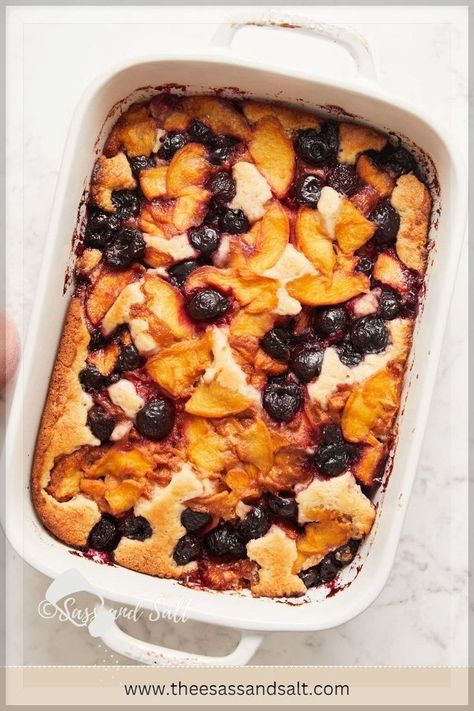 Dive into our easy Peach and Cherry Cobbler recipe, reminiscent of a fruit-laden snack cake. Pour a thick batter into a greased dish, top it with fresh or frozen peaches and cherries, and watch as it bakes into delightful pockets of fluffy cake mingled with juicy fruit, all framed by a chewy, buttery edge. This simple, foolproof recipe is your ticket to a crowd-pleasing dessert. Peaches And Cherries, Cherry Cobbler Recipe, Cobbler Crust, Cherry Crisp, Cobbler Easy, Kid Friendly Dessert, Frozen Peaches, Cobbler Topping, Fluffy Cake