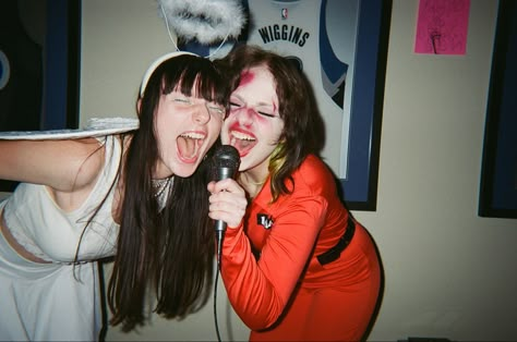 halloween party angel singing screaming into microphone film fujifilm disposable friends aesthetic Scream Singing Aesthetic, Art Reference Photos Friends, People Singing Reference, Two People Singing Reference, Singing With Microphone Pose, Screaming Into Microphone, Singing Into Microphone Reference, Singing Aesthetic Microphone, Singing With Friends Aesthetic