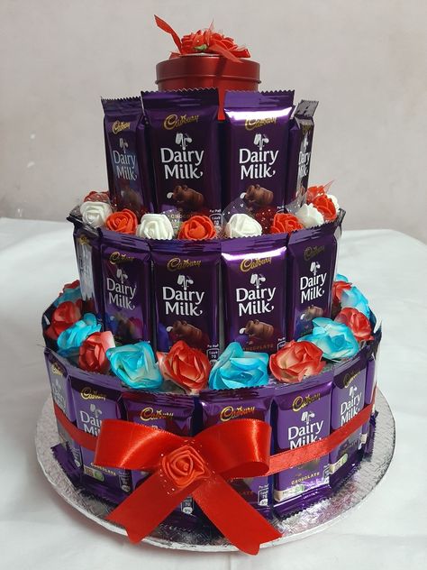 Dairymilk Bouquet, Chocolate Display Ideas, Engagement Arrangements, Chocolate Gift Basket Ideas Creative, Chocolate Gift Basket Ideas, Cake Hamper, Bucket Uang, Chocolate Tower, Hamper Diy