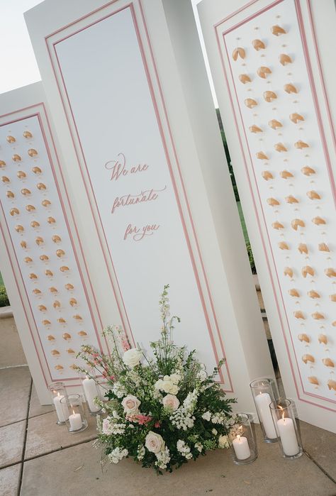 This beautiful San Diego wedding venue featured a custom pink and white fortune cookie seating chart wall. It was an ode to the bride's culture and the perfect way to include a unqiue detail in the wedding. Seating Chart: Studio Restore, Photo: Ria Georgia, Florist: Angelical Flowers Cookie Seating Chart, Studio Restore, Seating Chart Wall, San Diego Wedding Venues, 2024 Inspiration, Welcome To Our Wedding, Fortune Cookie, Seating Chart Wedding, San Diego Wedding