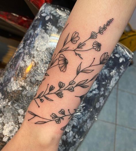 Adding To A Tattoo Ideas, Sleeve Wrap Tattoo, Botanical Wrap Tattoo Upper Arm, Wild Flower Shoulder Tattoo, Fine Line Floral Arm Wrap Tattoo, Wildflower Wrap Around Tattoo, Sunflower Wrap Around Tattoo, Flower Wrap Tattoo, Forearm Wrap Around Tattoo