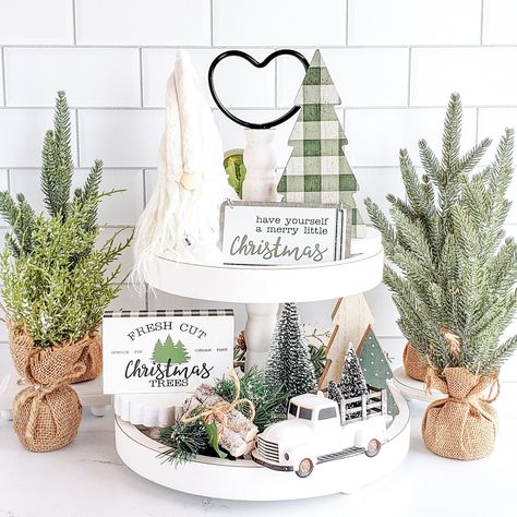 Simplify your holiday decorating with our deluxe farmhouse Christmas decor set! Each piece is perfectly coordinated and sized to fit your tiered tray, shelf, or any small vignette. Say goodbye to the frustration of mismatched decor and enjoy a beautifully styled space with ease. NOTE: The tiered tray and other items shown are for display purposes only and are NOT included in the decor set. Everything included is listed below. Sizes are approximate. Colors variations and styles may vary. The Merr Christmas Vignettes Farmhouse, Console Table Decorating For Christmas, Christmas Kitchen Bar Decor, Green Farmhouse Christmas Decor, 2 Tier Christmas Tray Decor, Christmas Tier Tray Ideas, Tiered Tray Christmas Decor, Christmas Bench Decor, Christmas China Cabinet Decor