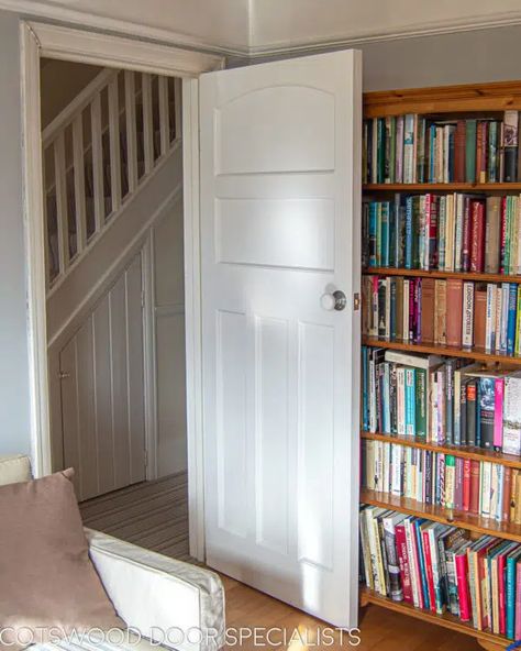 A tasteful 1930s bespoke internal door painted white and fitted with a white porcelain door knob. Made in hardwood for stability, the door features five recessed flat panels including a classic arched panel at the top. Its clean lines and minimalist appearance are typical of interior design for this era, where strong geometric shapes were in favour. Installed in an stylish dove-grey living room with a traditional picture rail. 1930s Internal Doors, 1930s Doors, 1930s Living Room, 1930s House Interior, Two Panel Doors, 1930s Semi, Internal Oak Doors, Edwardian Home, Porcelain Door Knobs