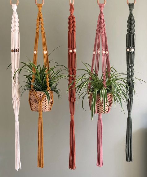 Boho Macrame Plant Hanger handmade from 100% recycled natural cotton and available in two sizes and a choice of five colours. Featuring intricate spiral knot details and lovely wooden beads.   SUSTAINABLE, NATURAL, AND HANDMADE WITH LOVE  All my macrame pieces are 100% plastic-free and made using natural, sustainable premium quality materials. Each plant hanger is carefully handmade to order in my studio in Ashbourne, Derbyshire. For every order made - I also plant a tree!  COLOURS: Available in Beaded Plant Hanger, Spiral Knot, Wall Mounted Planters, Hanging Terrarium, Hanging Plant Wall, Macrame Hanger, Macrame Patterns Tutorials, Boho Macrame, Macrame Plant Hangers