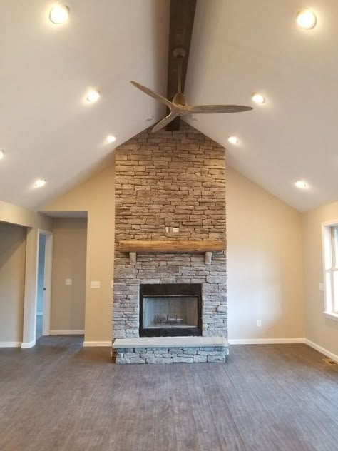 Stone Fireplace with vaulted ceiling and wood beam Vaulted Ceiling With One Center Beam, Beam In Vaulted Ceiling, Fireplace With Beam Ceiling, One Wood Beam On Ceiling Living Room, One Beam Vaulted Ceiling, Stone Fireplace Vaulted Ceiling Wood Beams, Stone Vaulted Fireplace, Faux Fireplace Diy Vaulted Ceiling, Fireplace Mantle Vaulted Ceiling