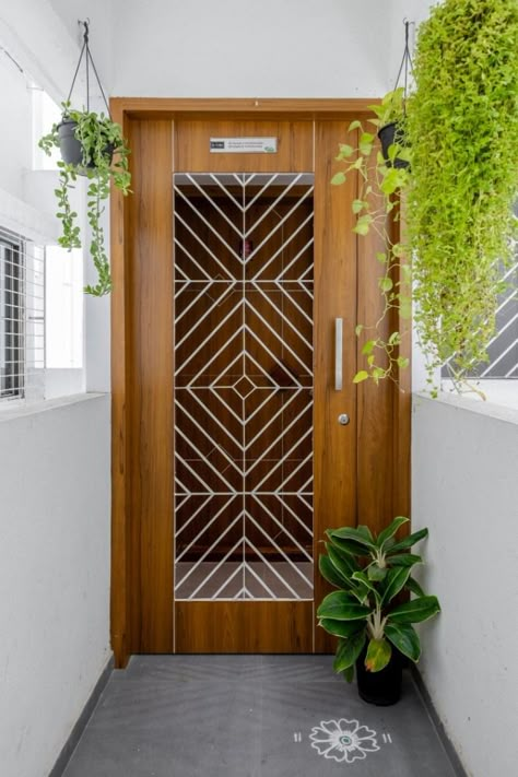 Tapas – Residential Interior | Studio 32 | Pune – Interiorlover Projects Safety Door Wooden Design, Wooden Door Colour Ideas, Modern Safety Door Design, Penthouse Door, Safety Door Design Entrance, Apartment Front Doors, Security Door Design, Safety Doors, Wooden Door Entrance