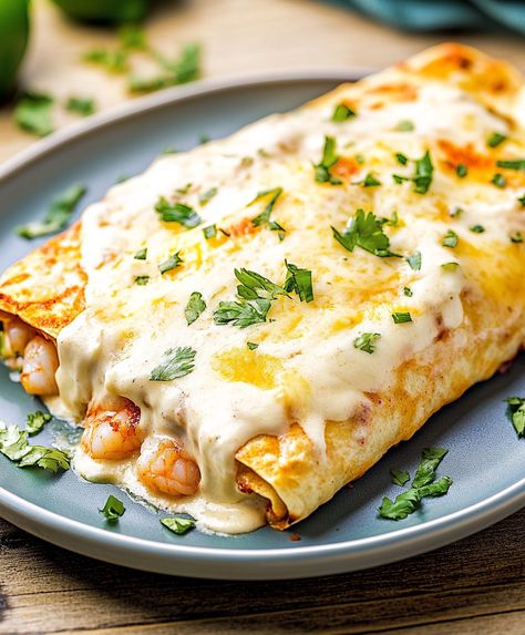 These creamy shrimp enchiladas are rich, flavorful, and easy to make—perfect for any occasion! Creamy Shrimp Enchiladas Recipe, Crab Enchiladas With White Sauce, Seafood Burrito Recipe, Shrimp Enchiladas With White Sauce, Crab Enchiladas Recipe, Crab Enchiladas, Creamy Shrimp Enchiladas, Shrimp Enchiladas Recipes, Seafood Enchiladas Recipe