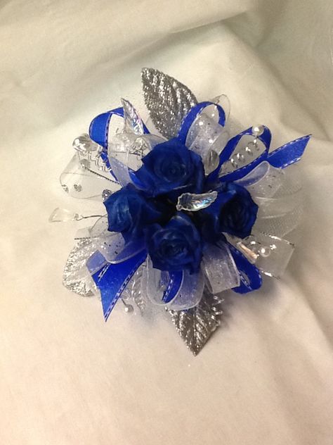 Blue roses with silver accents Blue And Silver Corsage, Blue Rose Corsage, Prom Corsage Diy, Corsage Diy, Diy Wrist Corsage, Prom Corsage And Boutonniere, Prom Bouquet, Diy Corsage, Corsage And Boutonniere Set