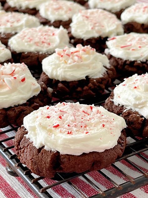 Get ready to indulge in the perfect holiday cookie- double chocolate brownie cookies with a delightful twist! These decadent cookies combine the rich and fudgy texture of brownies with the irresistible taste of chocolate. But that's not all - they are generously frosted with creamy peppermint frosting, infusing each bite with a refreshing burst of minty goodness. And to add a festive touch, these cookies are beautifully adorned with a sprinkle of crushed candy canes. Peppermint Twist Cookies, Frosted Peppermint Brownie Cookies, Peppermint Cookies Chocolate, Double Chocolate Peppermint Cookies, Peppermint Cookies Recipe, Peppermint Brownie Cookies, Peppermint Cookie Recipe, Peppermint Fudge, Chocolate Peppermint Cookies