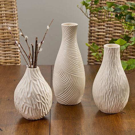 Display your favorite blooms and accentuate your decor effortlessly with our Textured Natural Bud Vase. Choose your favorite size and style to create a captivating focal point, or opt for all three to enjoy a variety of display options. Whether placed individually around your home or grouped together for a stunning arrangement, these neutral-hue vases will add a touch of natural beauty and sophistication to your space. Handmade Pottery Ideas, Slab Vase, Fall Tableware, Vase Tall, Ceramics Pottery Vase, Fox Decor, Park Designs, Clay Vase, Vase Shapes