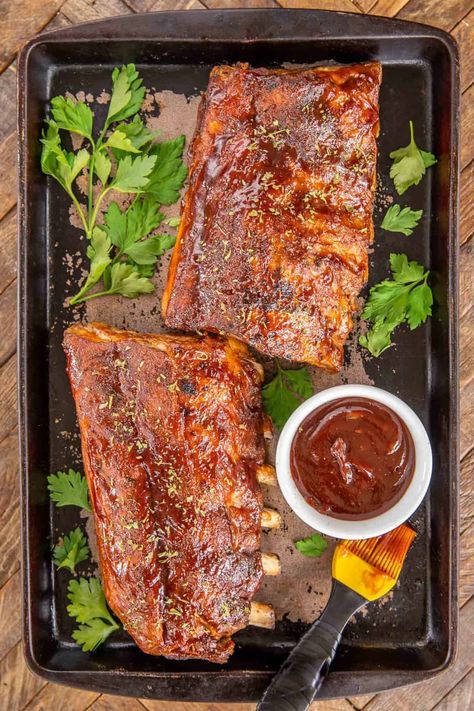 Slow Cooker Baby Back Ribs - a foolproof recipe for baby back ribs. These are THE BEST ribs I've ever eaten! PLUS they are super easy to make! Simply coat baby back ribs in a homemade BBQ rub and slow cook in the crockpot. Finish them with some BBQ sauce under the broiler. Baby back ribs, brown sugar, smoked paprika, kosher salt, black pepper, cayenne pepper, onion powder, garlic powder, and BBQ sauce. These are better than any restaurant! #slowcooker #crockpot #ribs #bbq Homemade Bbq Rub, Slow Cooker Baby Back Ribs, Babyback Ribs Recipe, The Best Ribs, Slow Cooker Ribs Recipe, Recipe For Baby, Ribs Bbq, Bbq Pork Recipes, Crockpot Ribs