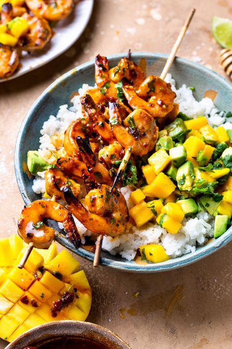 Shrimp skewers in a bowl with avocado mango salsa over rice Shrimp Bowls With Mango Salsa, Honey Chipotle Shrimp Bowl, Mango Salsa Shrimp Bowl, Grilled Shrimp Bowl, Honey Butter Shrimp, Coconut Rice And Mango, Shrimp Bowl, Honey Garlic Shrimp, Grilled Shrimp Skewers