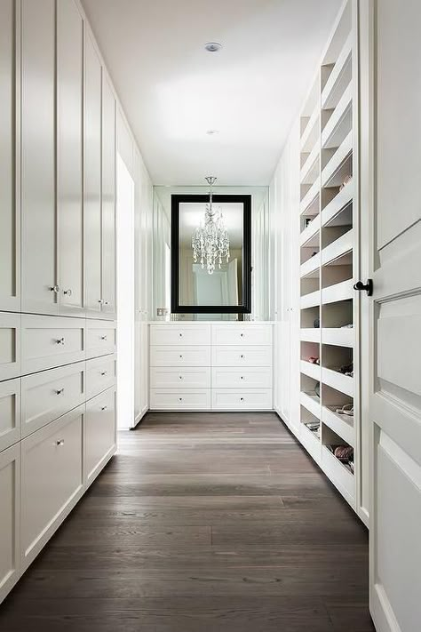 Walking into a long walk in closet you'll see a white dresser with a black mirror overhead. #ClosetStorageDesign Small Walk In Closet Design, Small Walk In Closet Organization, Closet Organization Cheap, Organizing Walk In Closet, Dresser In Closet, Organization Closet, Walking Closet, White Closet, Dream Closet Design