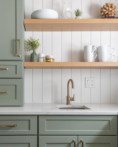 Feeling inspired by this beautifully crafted space featuring soft green cabinets, gold hardware, and warm wooden shelves against a clean white shiplap backdrop. From the thoughtful decor to the functional yet elegant design, every detail in this kitchen shines. Huge thanks to @laurabsanders for graciously opening her home and to Beacky @vmdwell for helping with the design and color choices 💚. Crafted with care by @forsyth.remodeling Green Cabinets Gold Hardware, Soft Green Cabinets, Shiplap Backdrop, Cabinets Gold Hardware, Green Cabinet, White Shiplap, Feeling Inspired, Green Cabinets, Oak Cabinets