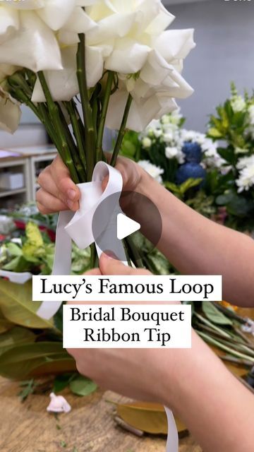 SYDNEY FLORIST • SYDNEY FLOWER DELIVERY • FIVE GENERATIONS 💐 on Instagram: "TIP FOR FLORISTS ✨💫 Watch for a super simple way to ribbon your next bridal bouquet. Using this loop technique means you have no bulky knot when you tie it off. It looks so neat wrapped around the stems.

😆 Disclaimer:  I put Lucy on the spot for the name of this! There may be lots of you using this technique, she’s just famous in our store amongst our florists because we hadn’t seen it before and she’s taught everyone!

😊 Any questions just ask x

#floristtip #floristhack #bouquetribbon #weddingflorist #weddingtip #flowersofspring #sydneyweddings #whiteroses #ribbon" How To Make A Simple Bridal Bouquet, Hoco Flower Bouquet Ideas, Wrapping Ribbon Around Bouquet, Bridal Bouquet Ribbon Wrap, How To Tie Bouquet With Ribbon, How To Tie Ribbon On Bouquet, How To Wrap A Bouquet With Ribbon, Wedding Bouquet Ribbon Wrap, Bouquet Ribbon Wrap