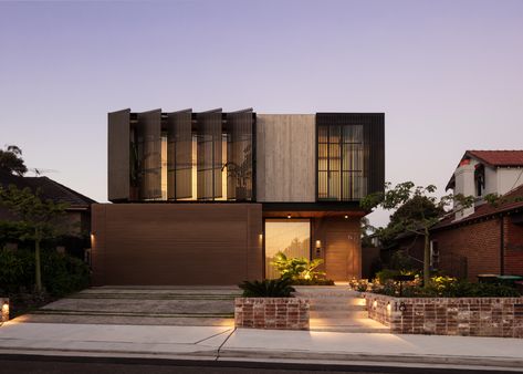 The Industrial Escape House is a contemporary residential design set within a classic suburban context. This striking home contrasts its robust industrial and brutalist materials with lush greenery and a central northern courtyard, creating a dynamic interplay between the raw, architectural elements and the serene, natural surroundings. Brutalist House Exterior, Brutalist House, Forest View, Residential House, Lush Greenery, Residential Design, Design Set, Architectural Elements, Dream Homes