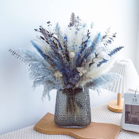 Blue Fake Flower Arrangements, Blue Pampas Arrangement, Blue Winter Centerpieces, Blue Winter Wedding Centerpieces, Pompadour Grass Centerpiece, Blue Pampas Grass Decor, Coastal Floral Arrangements, White And Blue Centerpieces, Pampas Grass Wedding Centerpieces