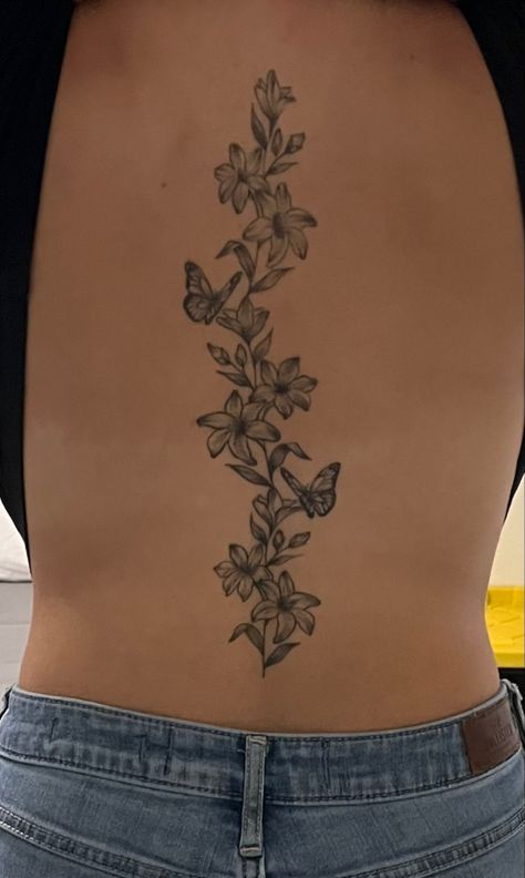 Spine tattoo Spine Tattoo With Flowers And Butterflies, Spine Tattoos Hummingbird, Flower Tattoos Spine Simple, Floral Butterfly Spine Tattoo, Spine Tattoos Butterflies And Flowers, Cute Simple Spine Tattoos For Women, Spine Tattoo Meaningful, Butterfly And Flower Spine Tattoo, Flower Butterfly Back Tattoo