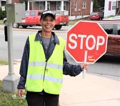 Crossing guard is a ray of sunshine for motorists Crossing Guard Costume, Crossing Guard, Tractor Trailer Truck, A Ray Of Sunshine, School Zone, Yellow Vest, Smile And Wave, School Bus Driver, Ray Of Sunshine