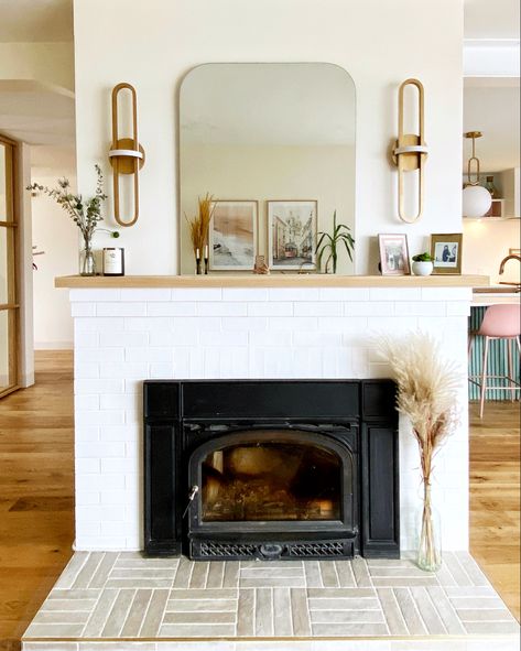 Modern Fireplace With Sconces, Lighting Around Fireplace, Modern White Brick Fireplace, Fireplace Mantle With Sconces, Mcm Fireplace Mantle, Lighting Above Fireplace, Sconces Next To Fireplace, Fireplace Sconces Lighting, White Tile Fireplace