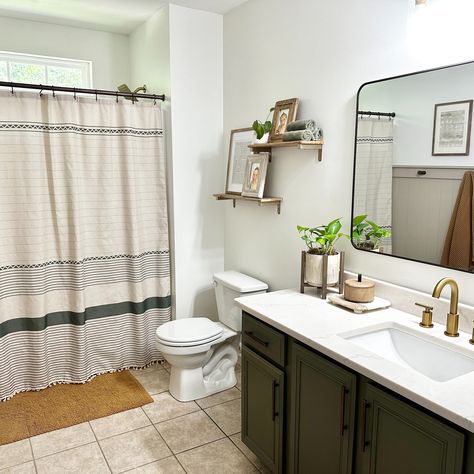 🤩🤩Love the sage green farmhouse shower curtain with tassel detail and pretty glass bottles for soaps.🍃🍃 #amazerbath #sagegreenfarmhouse #showercurtainlove #tasseldetail #glassbottles #soapdecor #farmhousedecor #bathroominspo #sagegreenlove #homedecorideas #rusticcharm #bathroomdesign #vintagedecor #farmhouseliving #cozyhome #countrystyle Sage Green Boho Bathroom Ideas, Farmhouse Bathroom Sage Green, Sage Restroom, Modern Farmhouse Bathroom Shower Curtain Green, Sage Green Boho Shower Curtain, Farmhouse Shower Curtain, Tassel Curtains, Boho Farmhouse, Bathroom Inspo