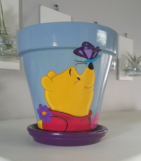 Winnie The Pooh Flower Pot, Pokemon Flower Pot, Disney Painted Pots, Disney Flower Pots, Plant Pots Crafts, Clay Pot Projects, Plant Pot Design, Flower Pot Art, Plant Pot Diy