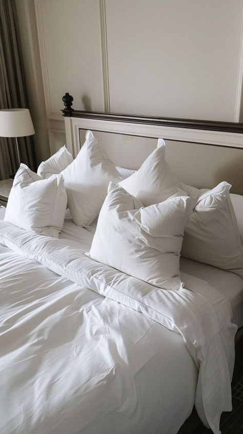 Luxurious hotel room bed with plush pillows, white linens, and serene ambiance Bed Pillows Arrangement, White Bed Pillows, Hotel Room Bed, Bed Pillow Arrangement, Luxurious Hotel, Pillow Arrangement, White Bed, Room Bed, White Bedding