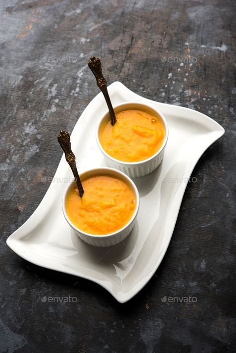 Aamras by stockimagefactory. Mango Pulp or Aam ras or Aamras served in small bowls, selective focus #Sponsored #Pulp, #Aam, #Mango, #Aamras Aam Ras, Mango Pulp, Small Bowls, Mango, Bowl, Festival, Tableware, Quick Saves