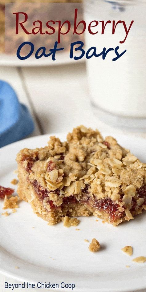 These raspberry oat bars are an easy dessert made with oatmeal, butter, brown sugar, and raspberry jam for a delicious treat! These raspberry oat bars are a cross between a granola bar and a cookie. They have a delightfully crumbly oat crust and topping and a sweet raspberry filling. I love making these for school lunches, road trips, or snacking. They are crumbly when eating, but they pack well in a container. They also stay fresh tasting for several days. Save this recipe! Raspberry Oat Bars, Raspberry Oatmeal Bars, Oat Bar Recipes, Raspberry Oatmeal, Raspberry Bars, Old Fashioned Oats, Raspberry Recipes, Granola Bar, Oat Bars